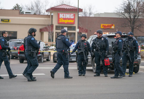Police officers gathered outside King Soopers grocery store.